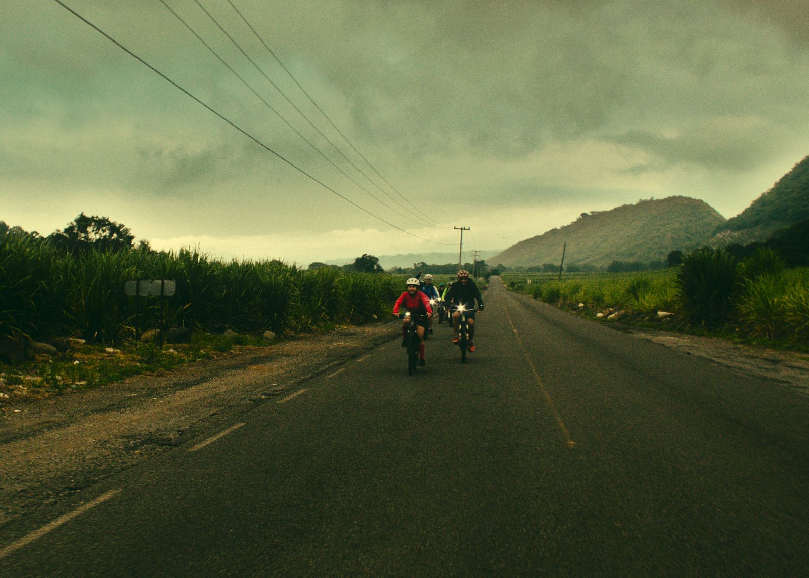 Cyclists riding together on a rural road